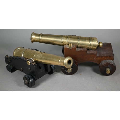 1163 - A 19th century brass model cannon with 26 cm brass barrel on wooden carriage, to/w another, later ca... 