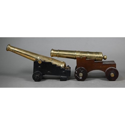 1163 - A 19th century brass model cannon with 26 cm brass barrel on wooden carriage, to/w another, later ca... 