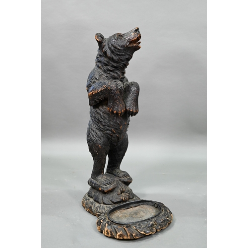 1165 - A 19th century Black Forest carved bear stick stand, with glass eyes and tin liner 86 cm high Lacks ... 