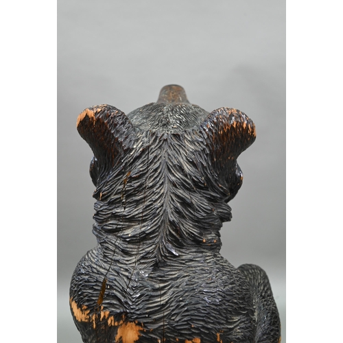 1165 - A 19th century Black Forest carved bear stick stand, with glass eyes and tin liner 86 cm high Lacks ... 