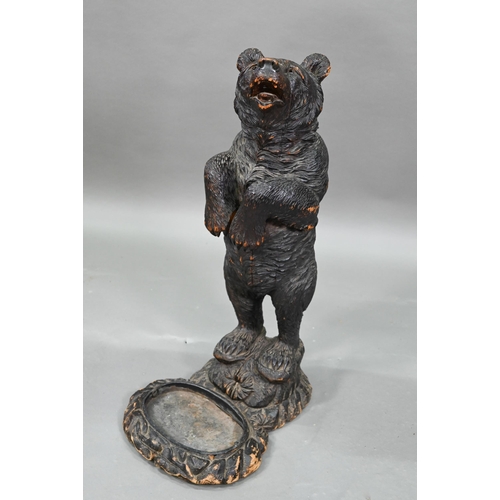 1165 - A 19th century Black Forest carved bear stick stand, with glass eyes and tin liner 86 cm high Lacks ... 