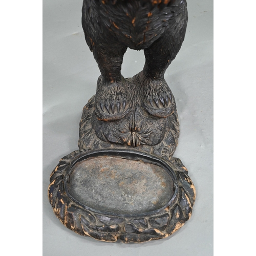 1165 - A 19th century Black Forest carved bear stick stand, with glass eyes and tin liner 86 cm high Lacks ... 