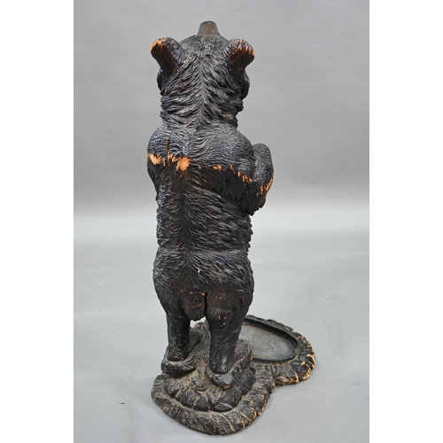 1165 - A 19th century Black Forest carved bear stick stand, with glass eyes and tin liner 86 cm high Lacks ... 