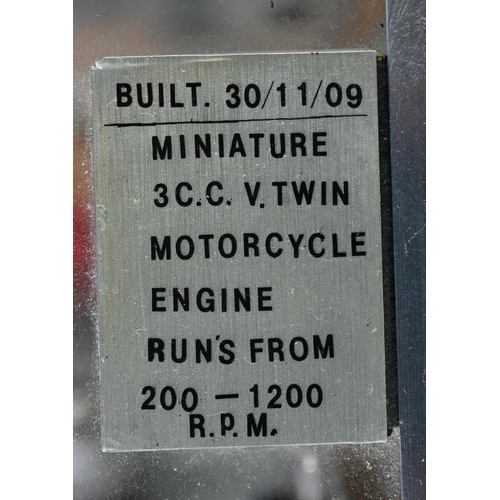 1178 - A Maier miniature 3cc V-twin motorcycle engine, runs 200-1200 rpm on propane/butane, 24 cm high, in ... 