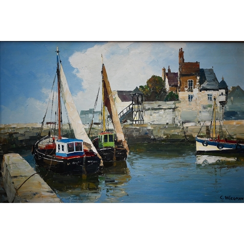 702 - C Weigman - Cornish harbour view, oil on canvas, signed lower right, 59 x 89 cm
