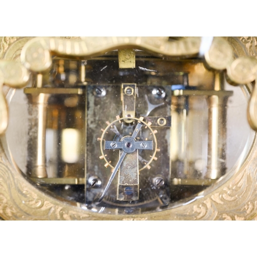 780 - W H Tooke, Paris, an engraved oval brass alarm carriage clock, the two train movement no 1013 with R... 