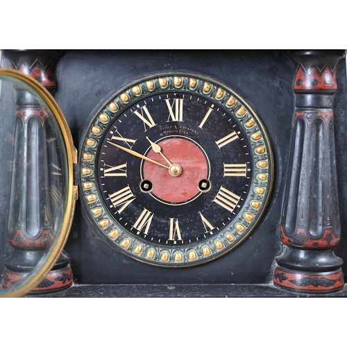 795 - A Victorian Egyptian Revival slate mantel clock, surmounted by a bronzed sphinx, the black dial with... 