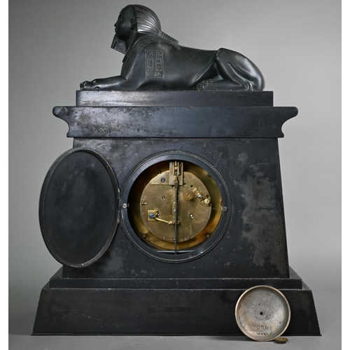 795 - A Victorian Egyptian Revival slate mantel clock, surmounted by a bronzed sphinx, the black dial with... 