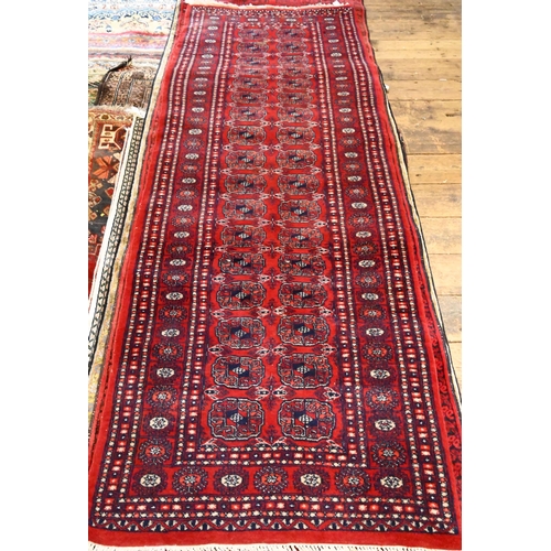 811 - A Turkoman Teke design red ground runner, 248 cm x 80 cm