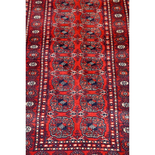 811 - A Turkoman Teke design red ground runner, 248 cm x 80 cm