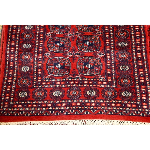 811 - A Turkoman Teke design red ground runner, 248 cm x 80 cm