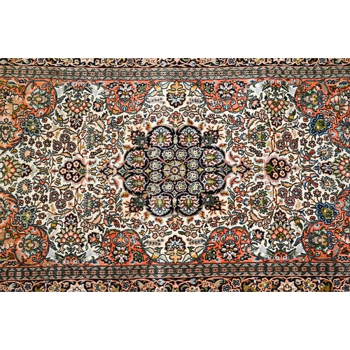 814 - A vintage Kashan silk Kashan design rug, the cream ground centred by a medallion, 160 cm x 92 cm