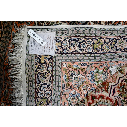 814 - A vintage Kashan silk Kashan design rug, the cream ground centred by a medallion, 160 cm x 92 cm