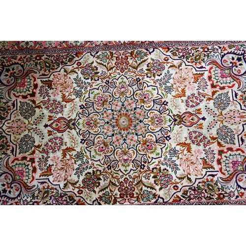 815 - A vintage Kasmiri silk garden design rug, 151 cm x 92 cm, loss to one corner