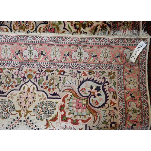 815 - A vintage Kasmiri silk garden design rug, 151 cm x 92 cm, loss to one corner