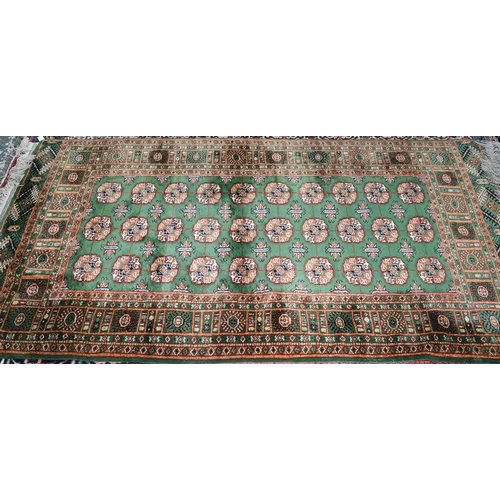 818 - Indian green ground rug, 200 x 123 cm