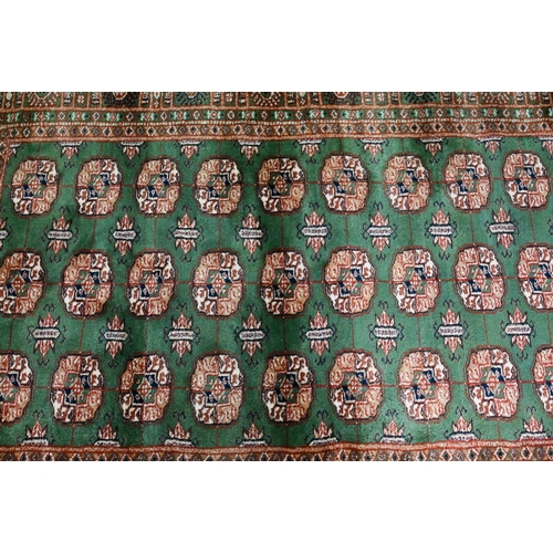 818 - Indian green ground rug, 200 x 123 cm