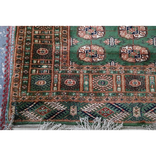 818 - Indian green ground rug, 200 x 123 cm