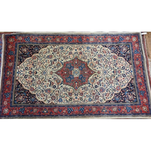 820 - An old North West Persian Sarouk rug, the camel ground with floral garden design, 217 cm x 133 cm