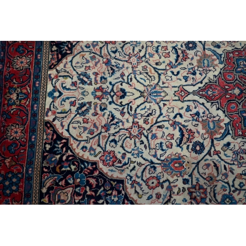 820 - An old North West Persian Sarouk rug, the camel ground with floral garden design, 217 cm x 133 cm