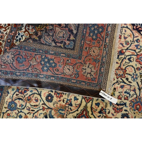 820 - An old North West Persian Sarouk rug, the camel ground with floral garden design, 217 cm x 133 cm