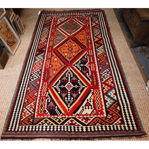 829 - A contemporary South West Persian Qashqai Kelim with repeating stylized lozenges in multi-colours, 2... 