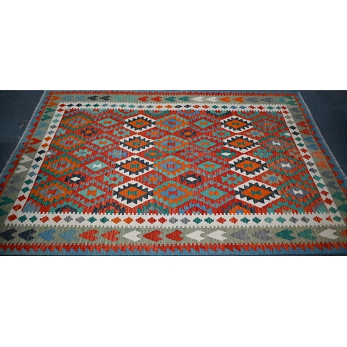 831 - A contemporary Anatolian kelim, the geometric design executed in multi-colours, 297 cm x 208 cm