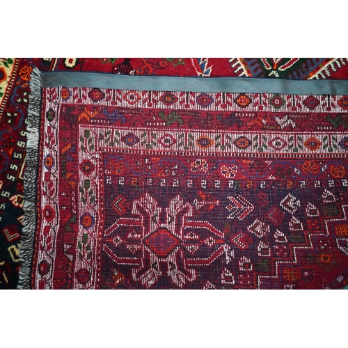 837 - A South West Persian Qashqai carpet, the triple pole design on red ground, 260 cm x 165 cm