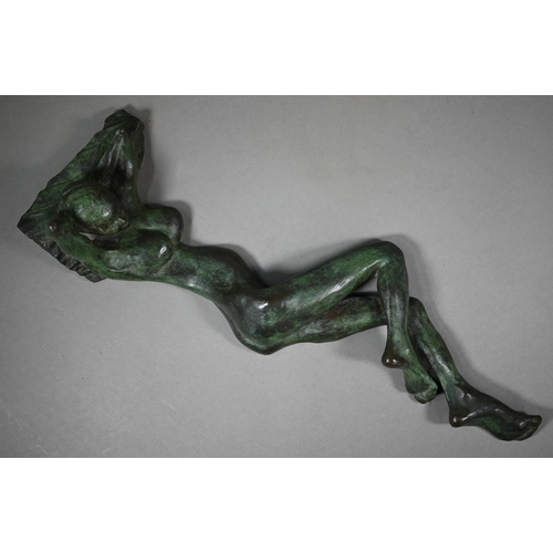 856 - Charlotte Jackson - A verdigris patinated bronze sculpture of a reclining woman, 42 cm long