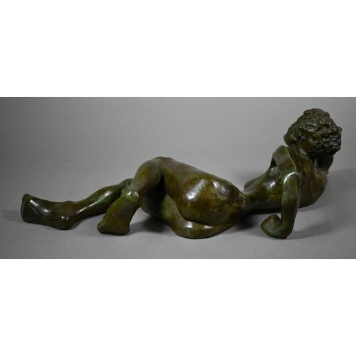 857 - Charlotte Jackson - A verdigris patinated bronze of a reclining nude woman, 49 cm long