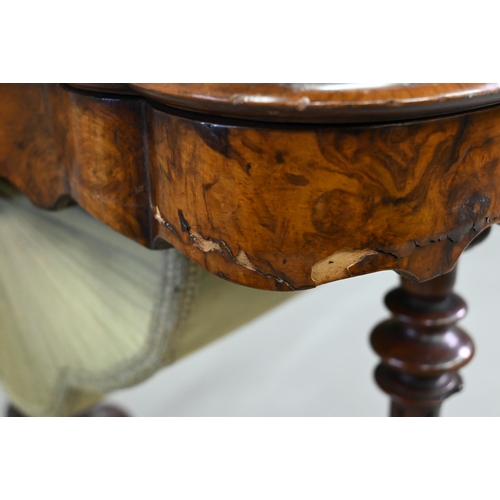 859 - A Victorian inlaid figured walnut work table, with a fitted interior over a plaited silk storage wel... 