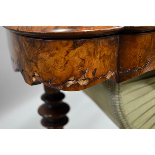 859 - A Victorian inlaid figured walnut work table, with a fitted interior over a plaited silk storage wel... 