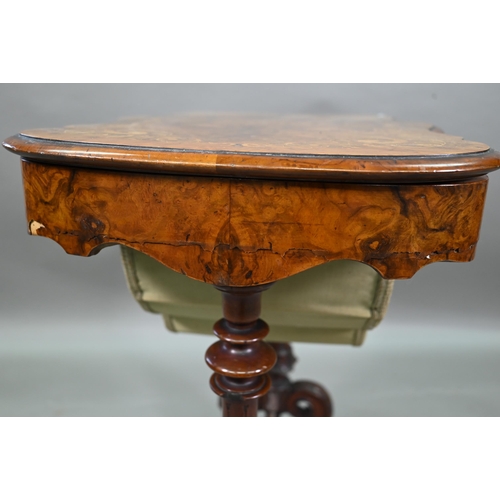 859 - A Victorian inlaid figured walnut work table, with a fitted interior over a plaited silk storage wel... 