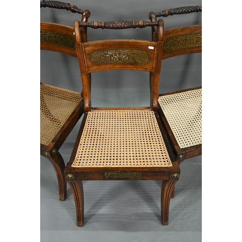 863 - A set of five Regency brass inlaid mahogany caned seat side chairs with sabre front legs to/w four o... 