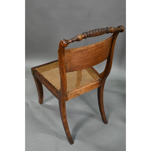 863 - A set of five Regency brass inlaid mahogany caned seat side chairs with sabre front legs to/w four o... 