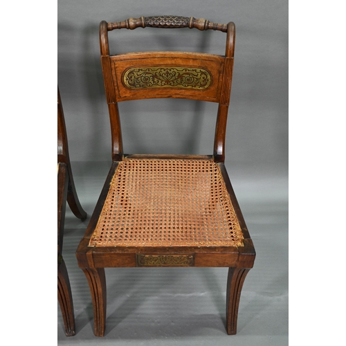 863 - A set of five Regency brass inlaid mahogany caned seat side chairs with sabre front legs to/w four o... 