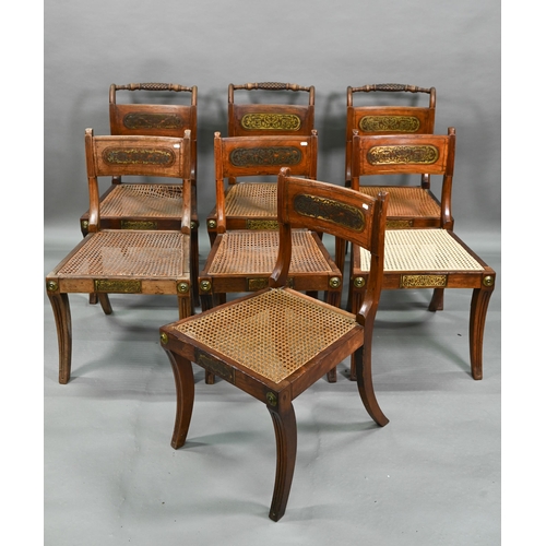 863 - A set of five Regency brass inlaid mahogany caned seat side chairs with sabre front legs to/w four o... 