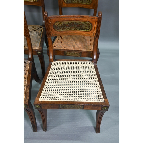 863 - A set of five Regency brass inlaid mahogany caned seat side chairs with sabre front legs to/w four o... 