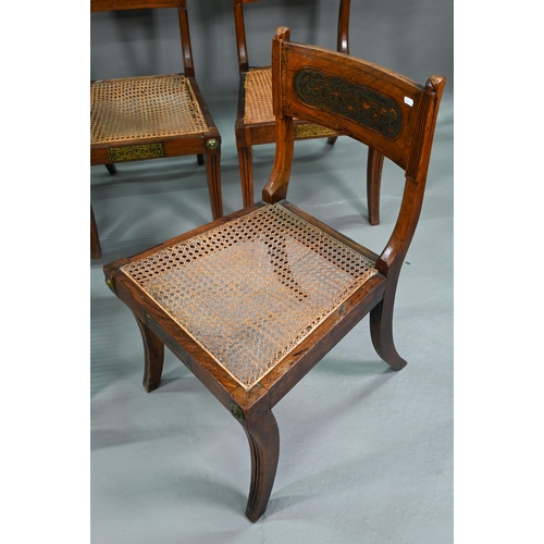 863 - A set of five Regency brass inlaid mahogany caned seat side chairs with sabre front legs to/w four o... 