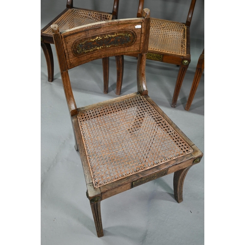 863 - A set of five Regency brass inlaid mahogany caned seat side chairs with sabre front legs to/w four o... 