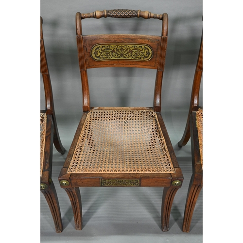 863 - A set of five Regency brass inlaid mahogany caned seat side chairs with sabre front legs to/w four o... 