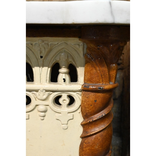 864 - A Victorian Puginesque style cast iron radiator cover, with lobed corner veined white marble top, 10... 