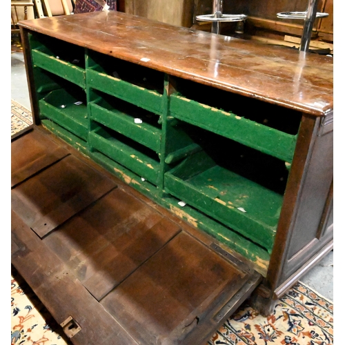 867 - A very large early 18th century oak coffer, the three plank top over a moulded frieze and four panel... 