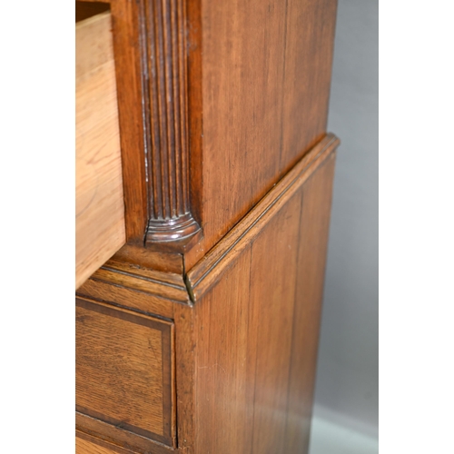 870 - A George III cross-banded oak chest on chest, the moulded cornice with inlaid boxwood roundels, over... 