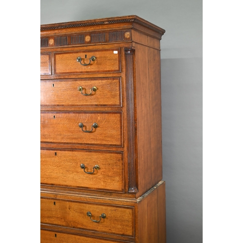 870 - A George III cross-banded oak chest on chest, the moulded cornice with inlaid boxwood roundels, over... 