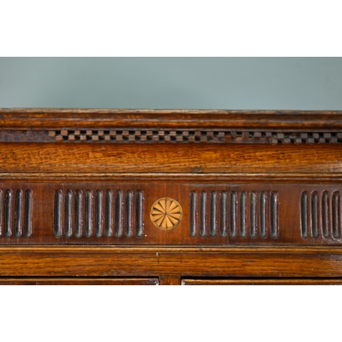 870 - A George III cross-banded oak chest on chest, the moulded cornice with inlaid boxwood roundels, over... 