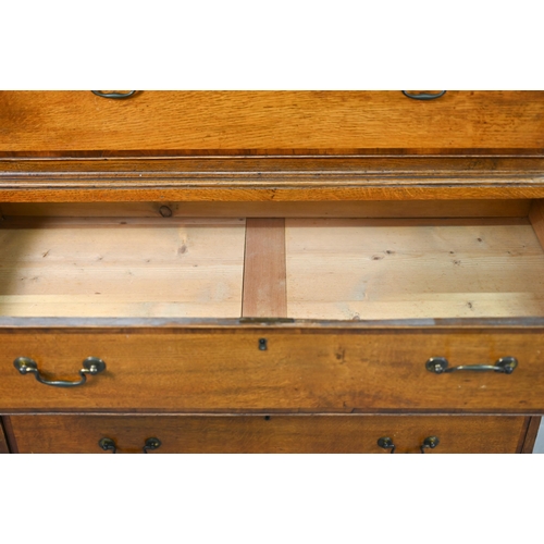 870 - A George III cross-banded oak chest on chest, the moulded cornice with inlaid boxwood roundels, over... 