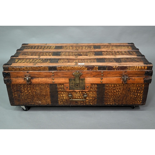 871 - A vintage steel and wood bound crocodile skin panelled trunk, with leather carrying handles, 92 cm w... 