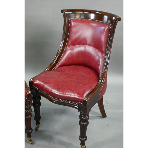 874 - A set of eight Regency mahogany dining chairs, with brass studded red cow hide upholstery and raised... 