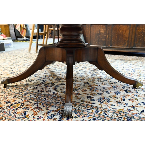 875 - A large George IV style circular extending mahogany dining table by Arthur Brett model 2239 'Mayfair... 